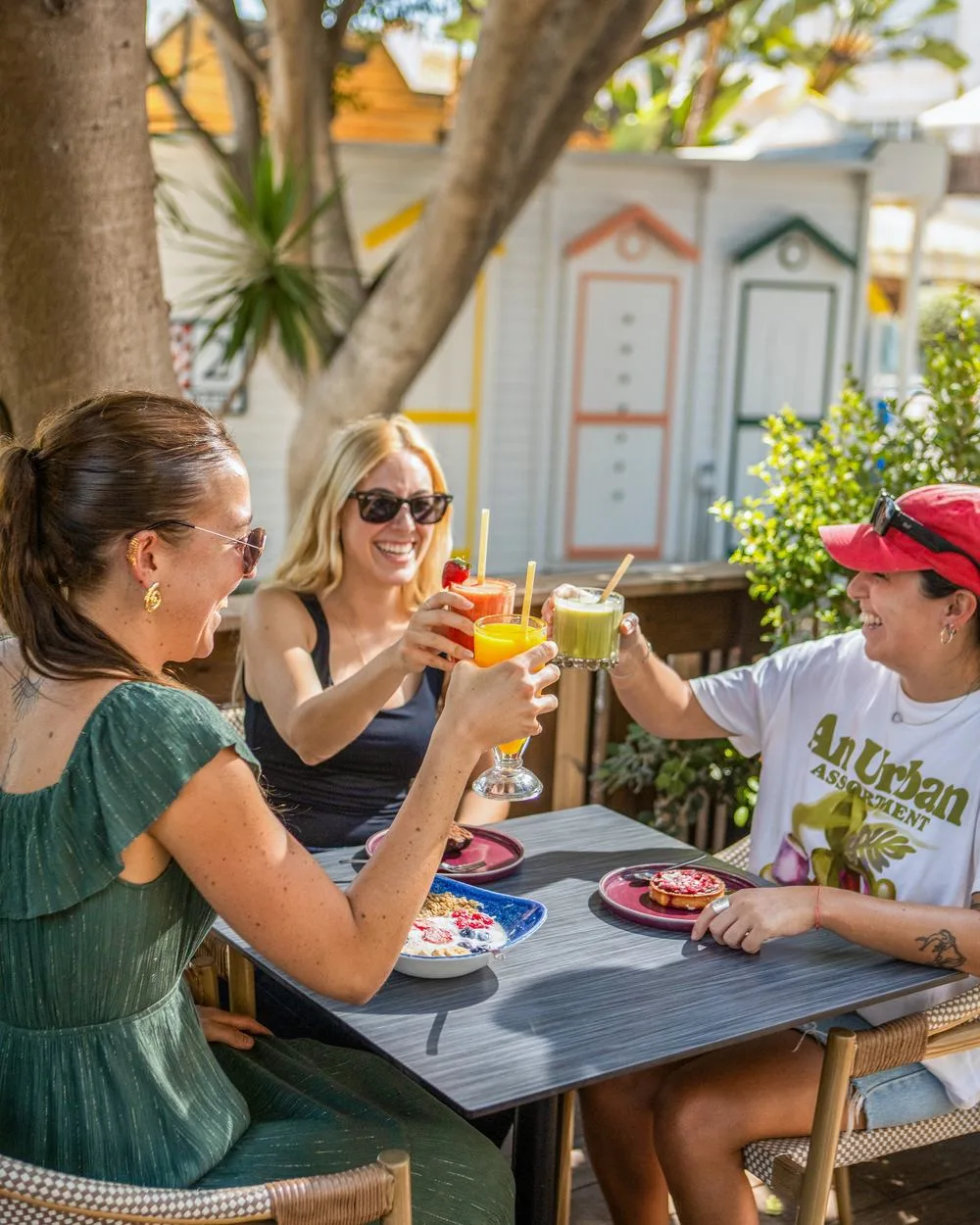 Friends toasting at Breeze